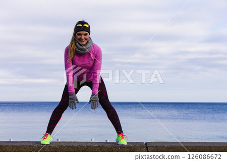 Woman fitness sport girl training outdoor in cold weather 126086672