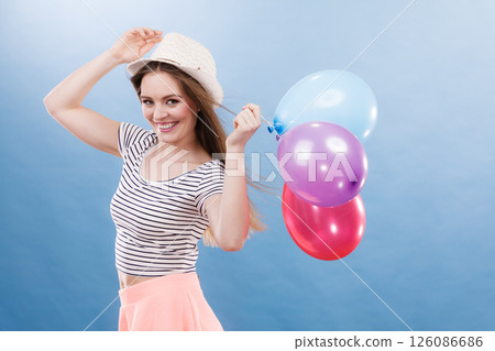 Woman summer joyful girl with colorful balloons 126086686