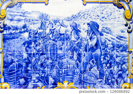 Blue azulejos with motifs from Douro Valley, train station of Pinhao, Portugal 126086892