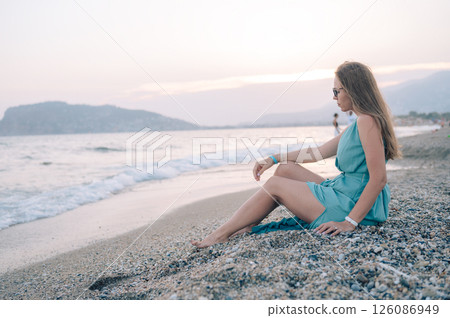 Woman in Flowing Dress on Seaside Pier 126086949