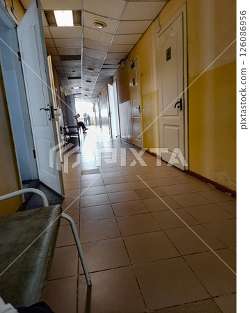 Long hospital corridors. Interior of hospital corridors. Long hospital corridors. Interior of hospital corridors. 126086956