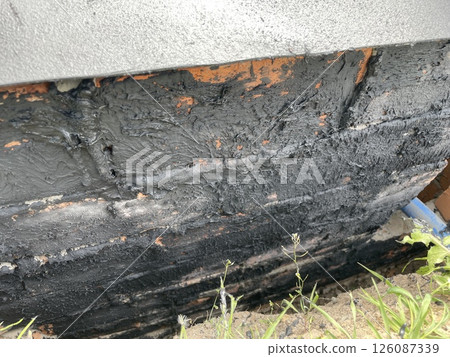 Bitumen rubber waterproofing mastic applied to surface 126087339