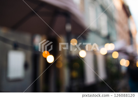 Blurred evening lights outside European cafe 126088120