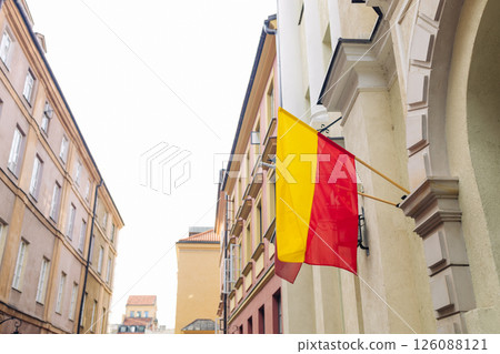 Warsaw city flag hanging on building in Old Town 126088121