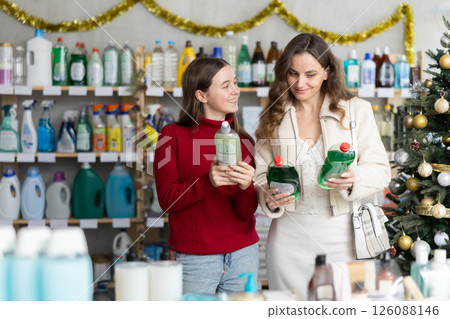 On New Year Eve, woman with teen girl choose dishwashing for allergy sufferers On New Year Eve, woman with teen girl choose dishwashing for allergy sufferers 126088146
