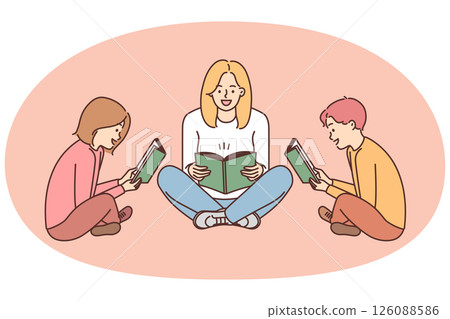 Mom and kids sit on floor with book and enthusiastically read interesting stories 126088586