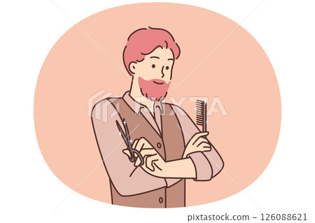 Man hairdresser from beauty salon stands with arms crossed holding comb and scissors 126088621