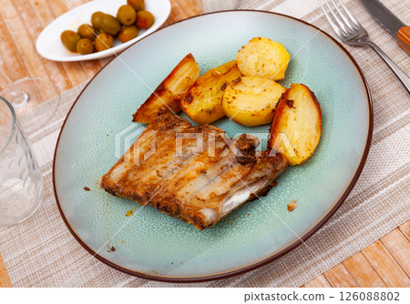 Roasted pork ribs with fried potatoes 126088802