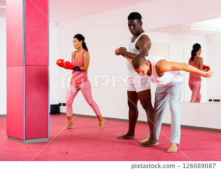 Sparring of two men at self-defense training in sports club Sparring of two men at self-defense training in sports club 126089087