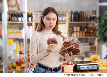 Girl choose hamon in store Girl choose hamon in store 126089090