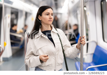 Girl in modern subway car 126089223