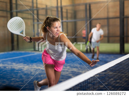 Woman with passion plays padel 126089272