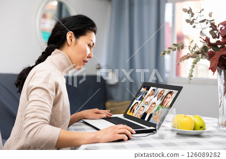 Asian woman is holding a video conference on a laptop 126089282