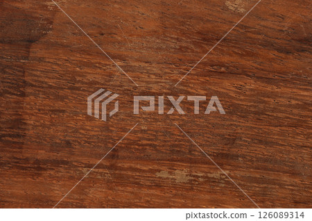 Textured wooden surface with rich brown hues and natural grain patterns for various uses 126089314