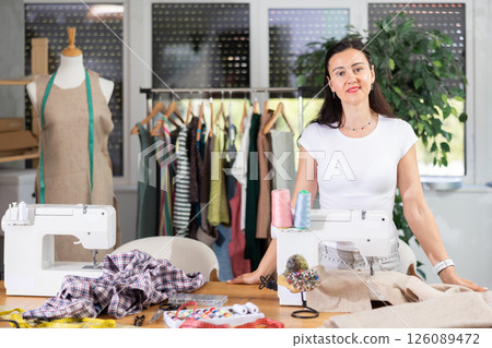 Woman tailor is standing in office 126089472