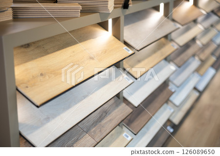 Laminate samples displayed on shelves in store 126089650
