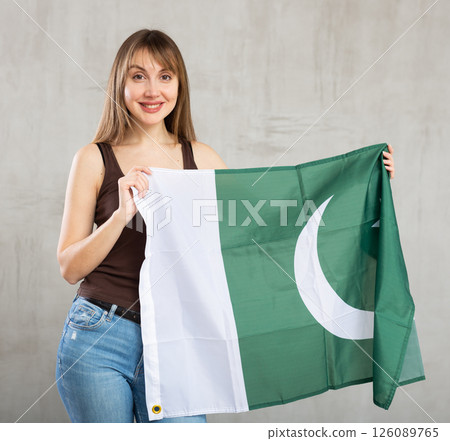 Excited positive girl with Pakistan flag rooting for your favorite team 126089765
