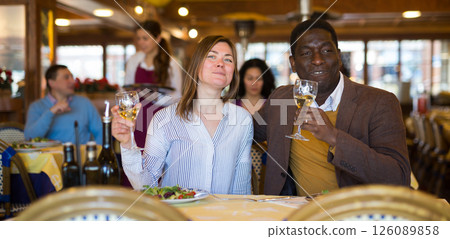 Portrait of a happy couple at a dinner in restaurant Portrait of a happy couple at a dinner in restaurant 126089858
