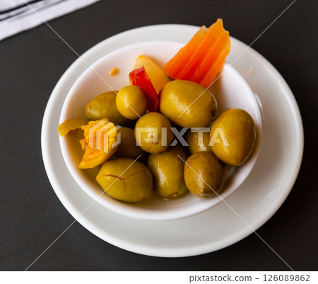 Pickled olives with a stone - a typical Spanish tapas. 126089862