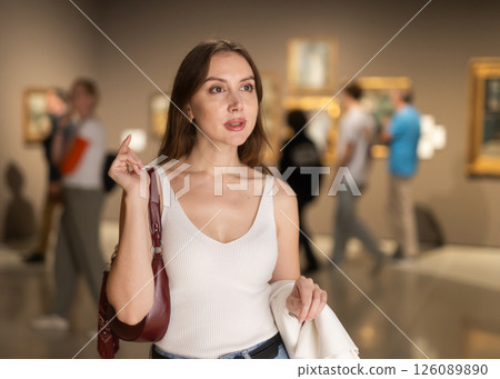 Girl view pictures and icons in museum hall Girl view pictures and icons in museum hall 126089890