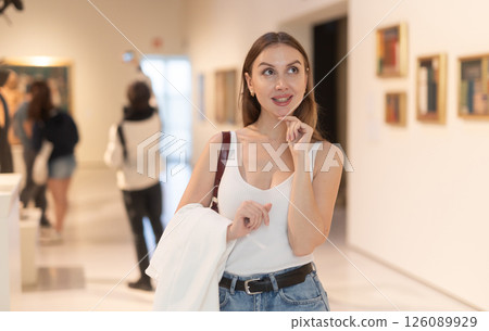 Girl view pictures and icons in museum hall Girl view pictures and icons in museum hall 126089929