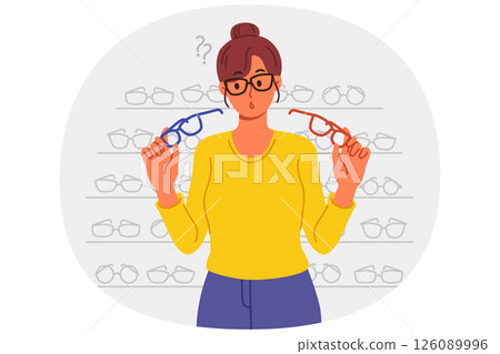 Woman buys glasses in store with large assortment of lenses and frames and chooses of two options Woman buys glasses in store with large assortment of lenses and frames and chooses of two options 126089996