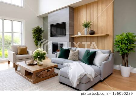 Modern living room showcasing comfortable sofa, fireplace, and large windows illuminating the space Modern living room showcasing comfortable sofa, fireplace, and large windows illuminating the space 126090289