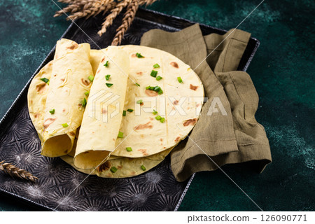 Lavash flat bread on green background 126090771