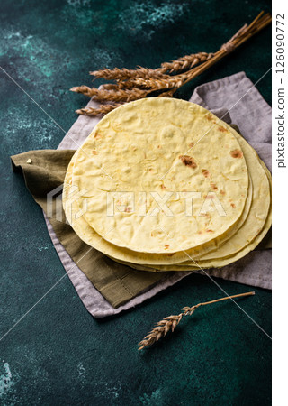 Lavash flat bread on green background Lavash flat bread on green background 126090772