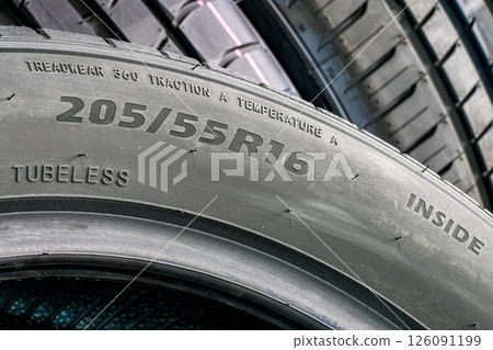 Side view of a tire with an indication of tire width, height, diameter and other quality indices 126091199