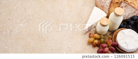 Jewish holiday Shavuot concept. Grains, milk and cheese on travertini stone background Jewish holiday Shavuot concept. Grains, milk and cheese on travertini stone background 126091515
