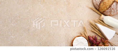 Jewish holiday Shavuot concept. Grains, milk and cheese on travertini stone background Jewish holiday Shavuot concept. Grains, milk and cheese on travertini stone background 126091516