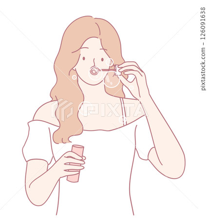 A joyful young girl is happily blowing colorful bubbles using her soap wand on a sunny day A joyful young girl is happily blowing colorful bubbles using her soap wand on a sunny day 126091638