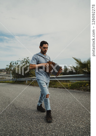 Music Following The Steps Of A Man Playing Accordion 126092278
