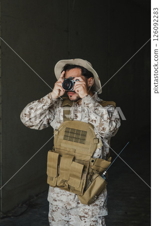 Soldier Taking Photos With A Vintage Camera While On A Mission Soldier Taking Photos With A Vintage Camera While On A Mission 126092283