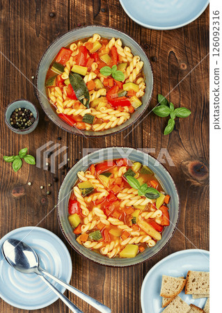 Italian minestrone soup on wooden. Italian minestrone soup on wooden. 126092316