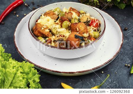 Grilled turkey breast and rice. 126092368