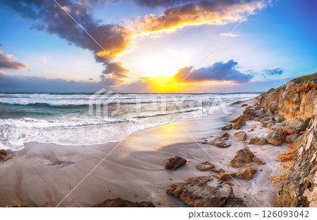 Unbelivable view of sunset on beach Capo San Marco Oristano on Del Sinis peninsula. Unbelivable view of sunset on beach Capo San Marco Oristano on Del Sinis peninsula. 126093042