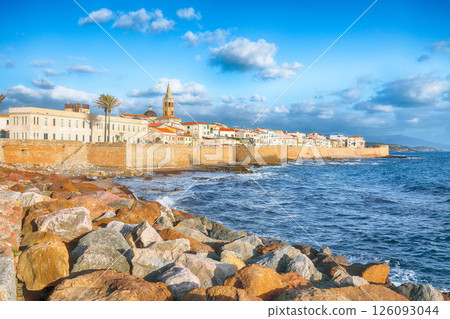 Astonishing evening cityscape of historical part of Alghero town. Astonishing evening cityscape of historical part of Alghero town. 126093044