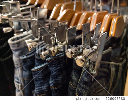 Discover stylish trousers on sale at a trendy clothing store showcase Discover stylish trousers on sale at a trendy clothing store showcase 126093380