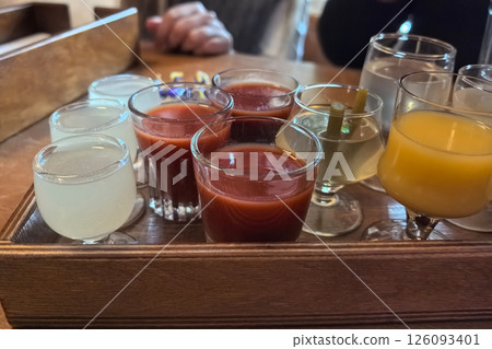 Experience a vibrant tasting of assorted beverages in a cozy setting Experience a vibrant tasting of assorted beverages in a cozy setting 126093401