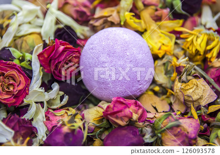 Aromatic bath bomb on dried flowers. Aromatic bath bomb on dried flowers. 126093578