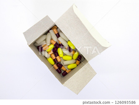Medical pills in a cardboard box package. 126093586