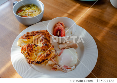 Western-style breakfast plate with morning sunlight streaming in Western-style breakfast plate with morning sunlight streaming in 126094528