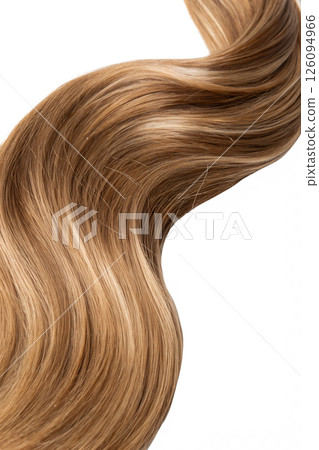 Close-up of a twisted strand of glossy light brown hair, shiny and smooth with natural highlights Close-up of a twisted strand of glossy light brown hair, shiny and smooth with natural highlights 126094966