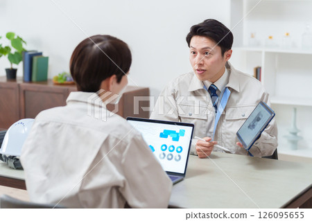 Businessmen in work clothes having a meeting 126095655