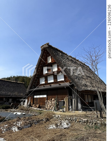 Shirakawa-go is historic village in Gifu Prefecture, famous for its gassho-zukuri farmhouses with steep thatched roofs, a UNESCO World Heritage Site. 126096236