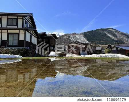 Shirakawa-go is historic village in Gifu Prefecture, famous for its gassho-zukuri farmhouses with steep thatched roofs, a UNESCO World Heritage Site. 126096279