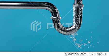 Leaking water from chromium stainless steel pipe under sink. Drain leak water from pipe plumbing in bathroom as water clogged drop. Blue bathroom background isolated Leaking water from chromium stainless steel pipe under sink. Drain leak water from pipe plumbing in bathroom as water clogged drop. Blue bathroom background isolated 126096411
