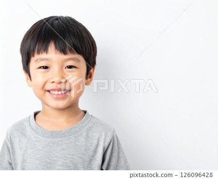 Smiling Japanese boy on white background 126096428
